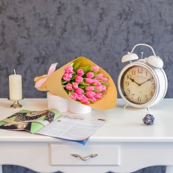 Bouquet of pink tulips in natural paper