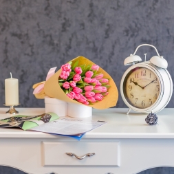 Bouquet of pink tulips in natural paper